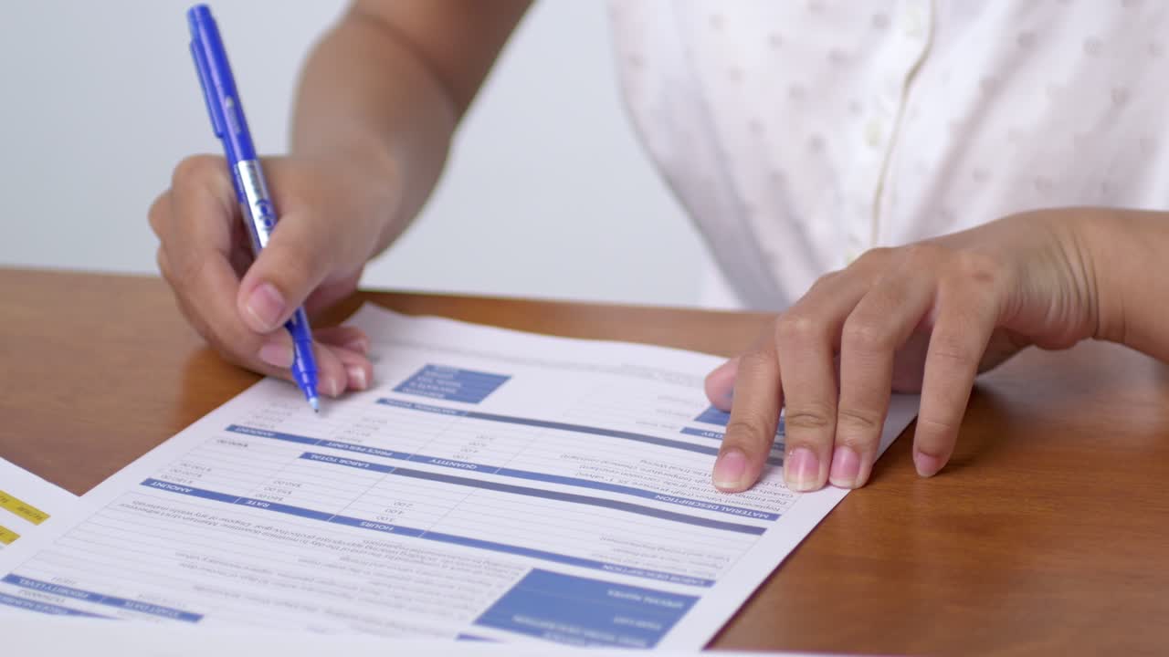 Document preparation process office setting business activity indoor environment close-up view efficiency in action