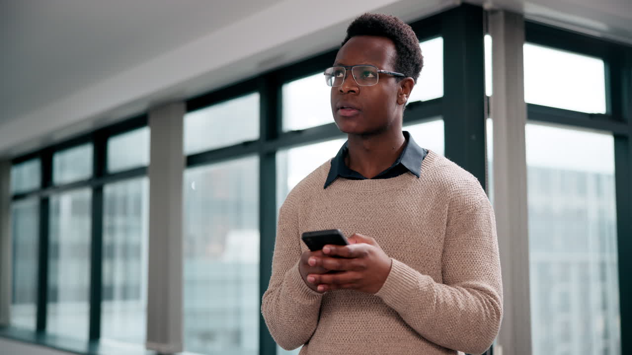 Man using smartphone in office