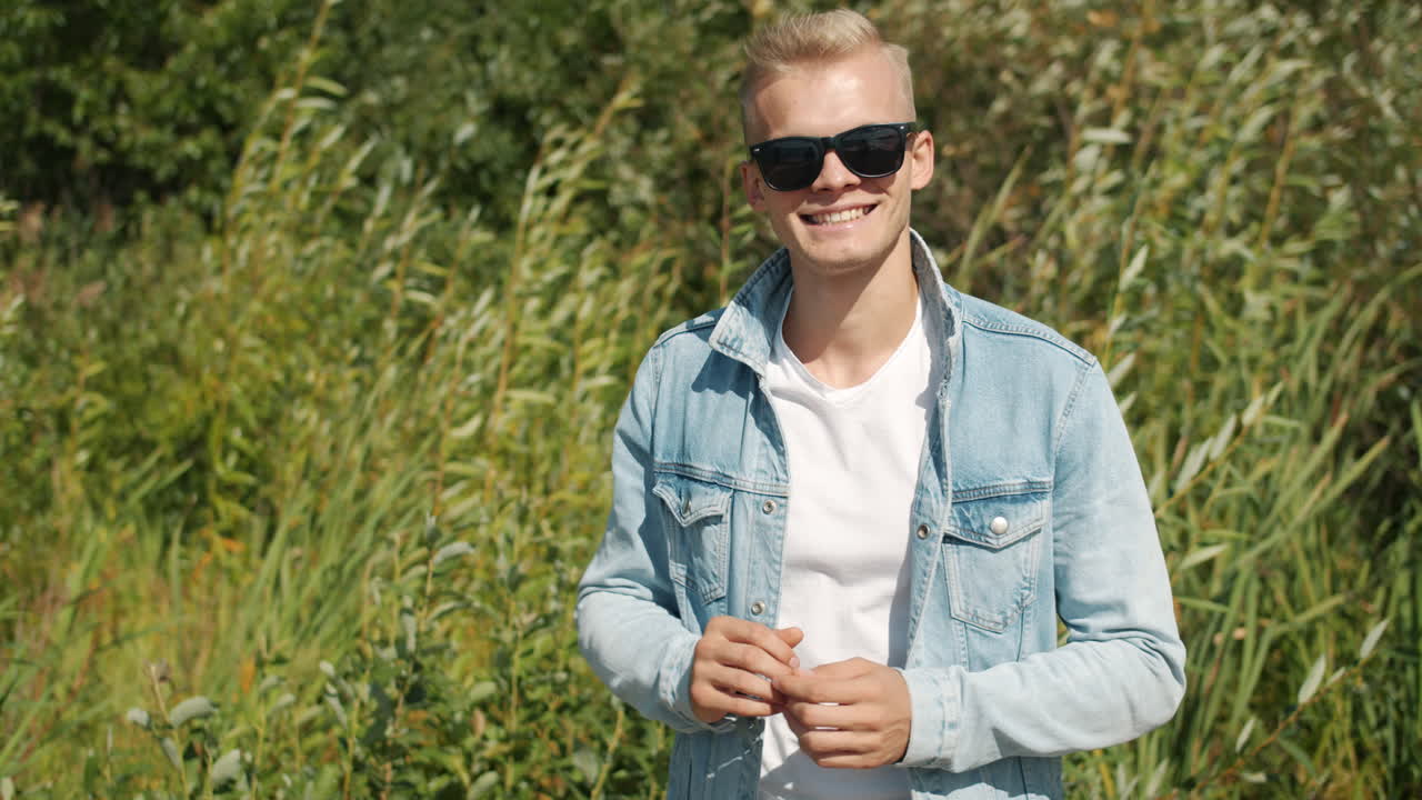 Man in a denim jacket outdoors