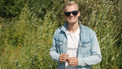man in a denim jacket outdoors