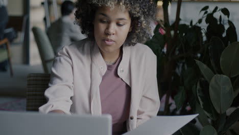 young woman working on laptop in office