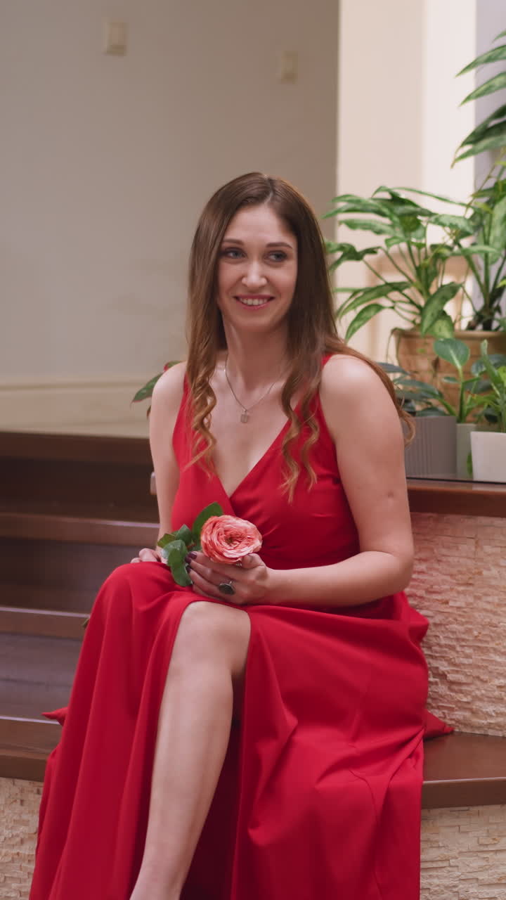 Artist paints woman with rose in hands. Woman model sparks painter imagination in vibrant atmosphere of art shop. Exudation of alluring charm