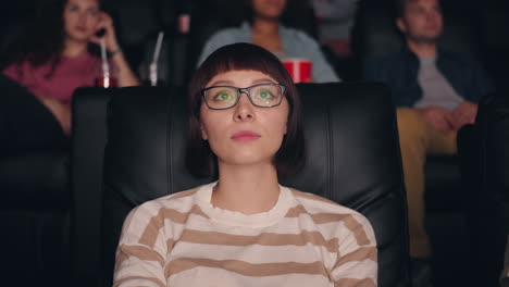 woman watching a movie in a theater