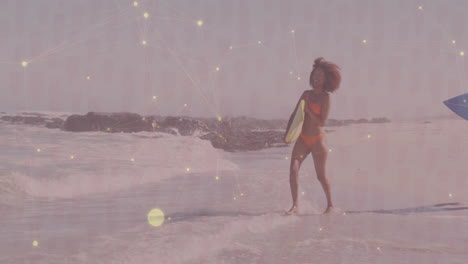 woman jumping through surf holding yellow board, overlaying animated health chart and heart icon