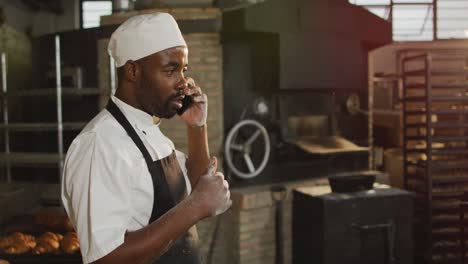 animation of african american male baker having call