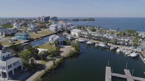 4k drone video of waterfront homes on canals in hudson beach on the gulf of mexico in florida