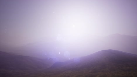 aerial green hills landscape in fog