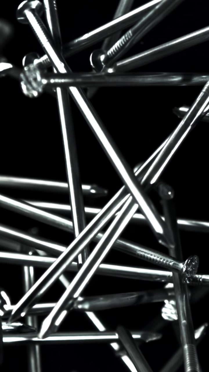 Close-up Rack Focus on Scattered Metal Nails