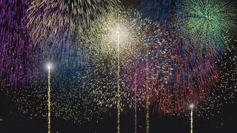 vibrant fireworks explode against a starry night sky