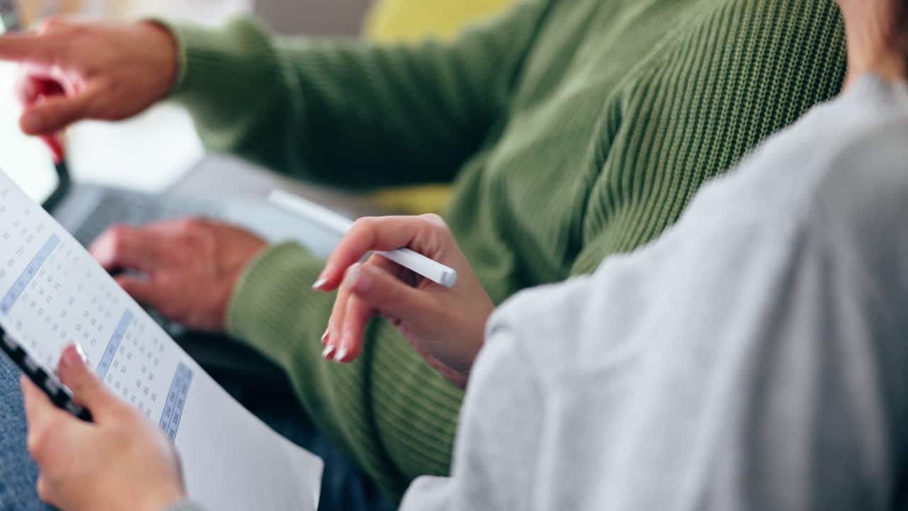 Couple, paperwork and planning for home mortgage