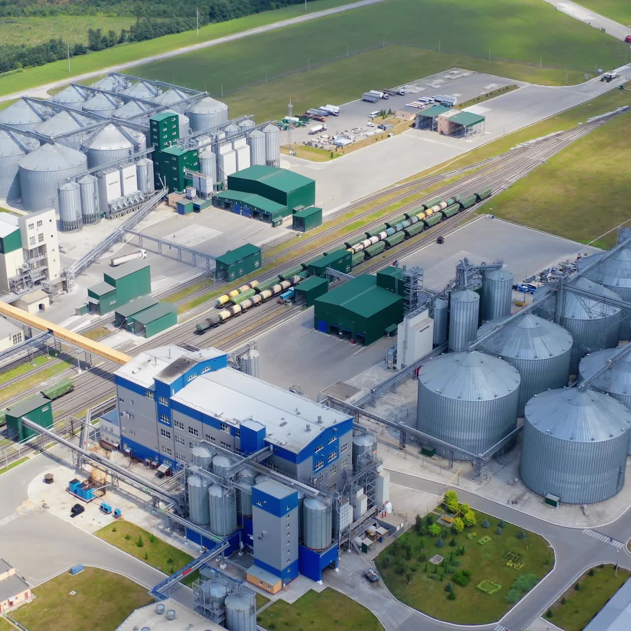 Aerial view of big factory storages. Modern industrial grain elevator storage