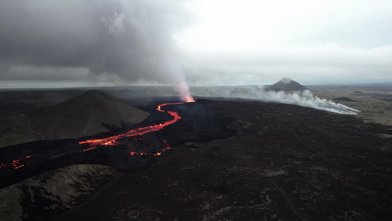 drone shot of the litli hrutur volcano in iceland with fog and smoke 7