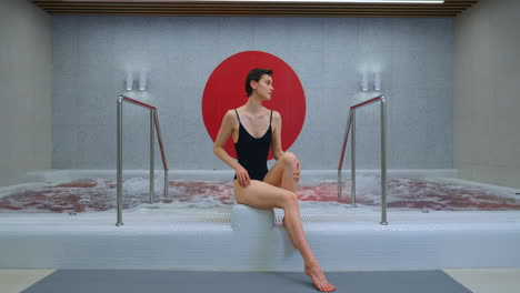 woman relaxing in a modern spa hot tub
