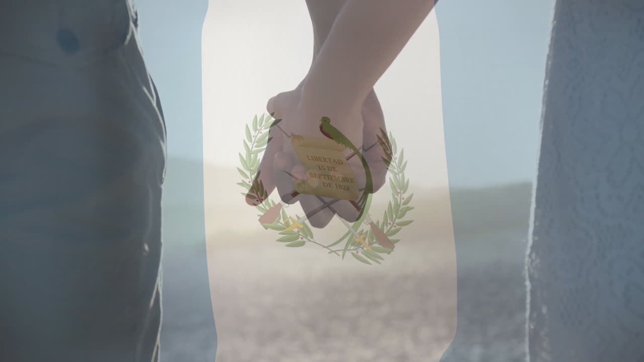 Holding hands, couple with Guatemalan flag animation overlay in background