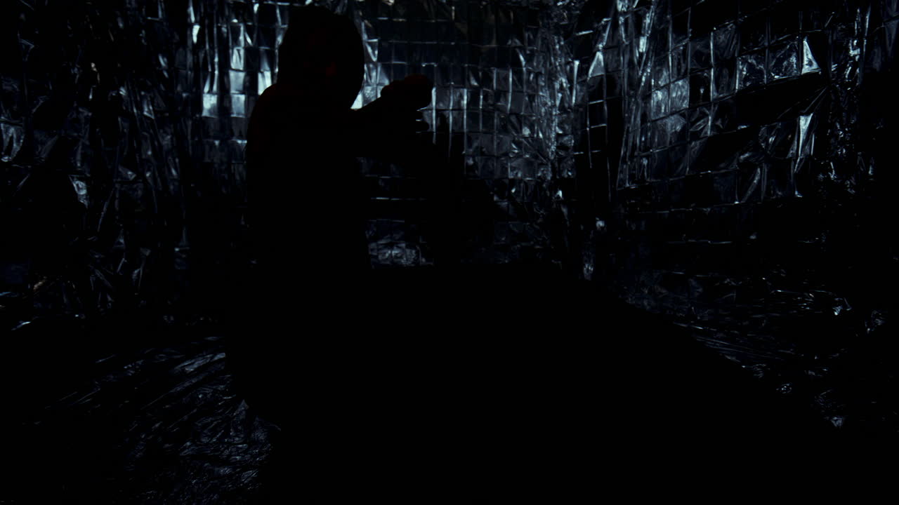 Woman Performing Contemporary Style Floor Work on Foil-Covered Surface