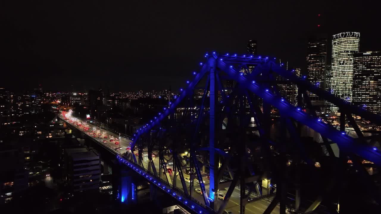 Push in orbiting drone shot of Brisbane City's Story Bridge