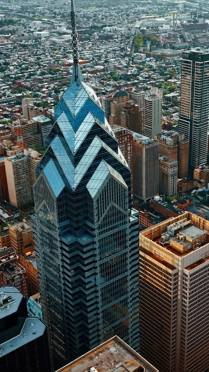 Skyscraper complex Liberty Place in Philadelphia. Drone footage rising above the cityscape at daytime. Vertical video