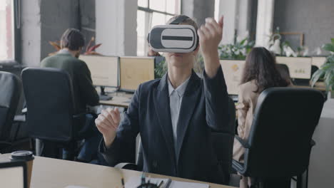 businesswoman using vr headset in office