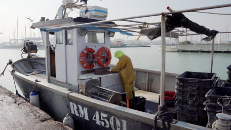 fisherman processing seafood on a boat at the harbor