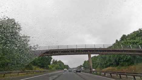 cars travel on a rainy highway in birmingham