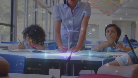 animation of stars over diverse schoolchildren writing