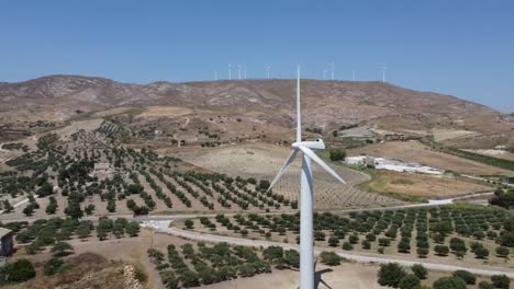 wind turbine generating sustainable energy for european farm, wind farm backdrop