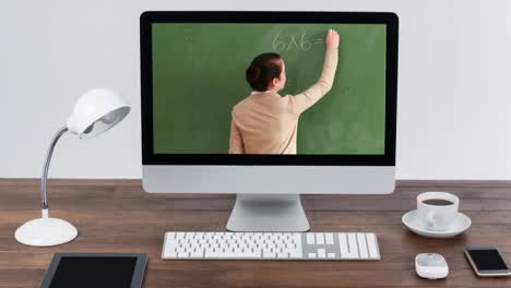 Animation-of-a-computer-monitor-showing-Caucasian-female-teacher-on-the-screen-