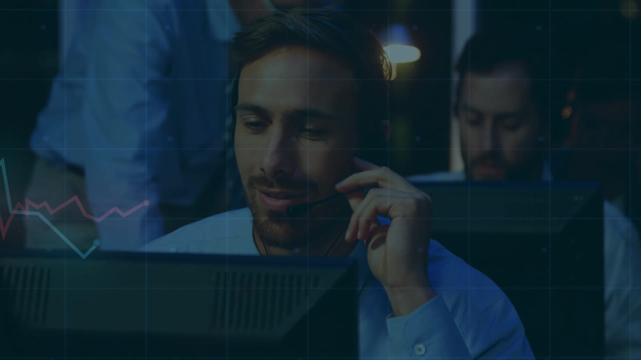 Wearing headset, businessman working on computer with animation of data graph