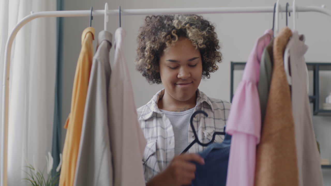 Woman choosing clothes in a wardrobe