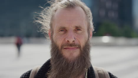 portrait-mature-bearded-hippie-man-smiling-happy-looking-confident-enjoying-carefree-urban-lifestyle-in-city-wearing-nose-ring