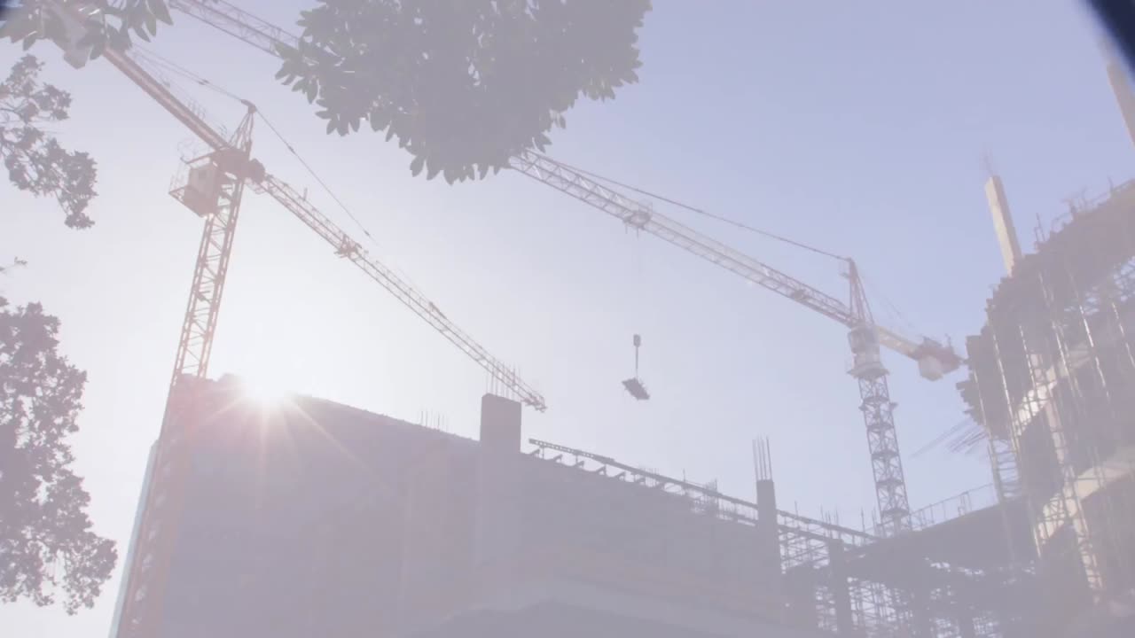 Magnifying glass over building plans