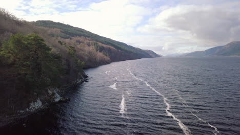 aerial footage of loch ness looking towards fort augustus on a sunny day, scottish highlands, scotland