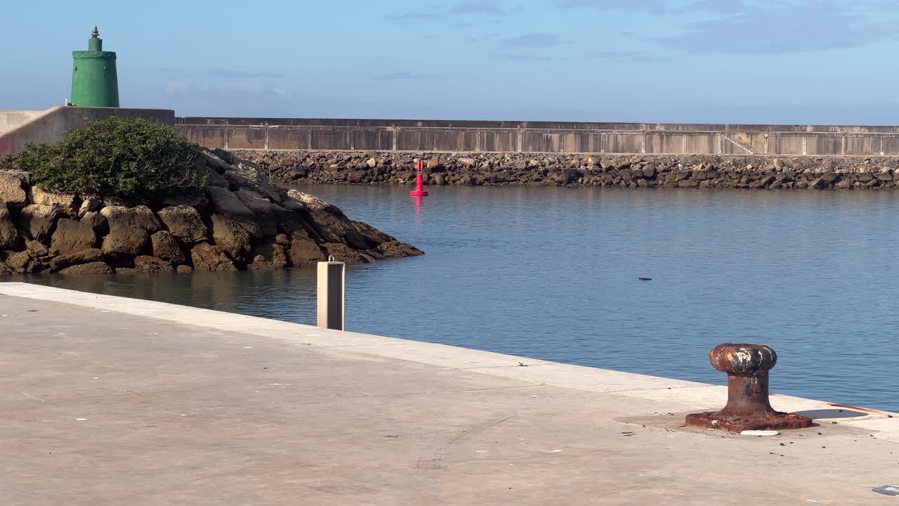 A bay with yachts and boats in sunny weather under a clear blue sky