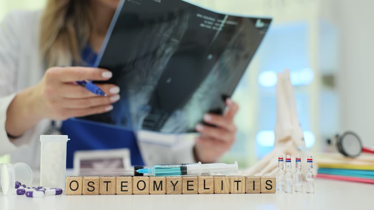 Doctor Examining X-ray for Osteomyelitis Diagnosis with Medical Supplies