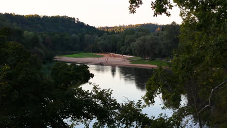 aerial approaching beach volleyball courts in sigulda, latvia; outdoor sports and recreation park.