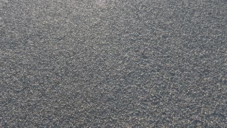 close-up view of moving gravel road