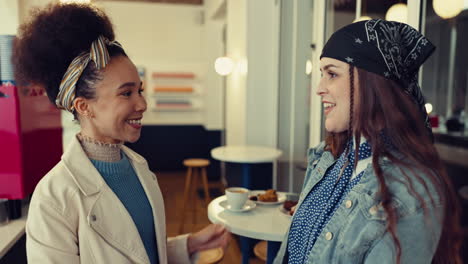 Happy-friends,-women-and-hug-at-cafe-for-care