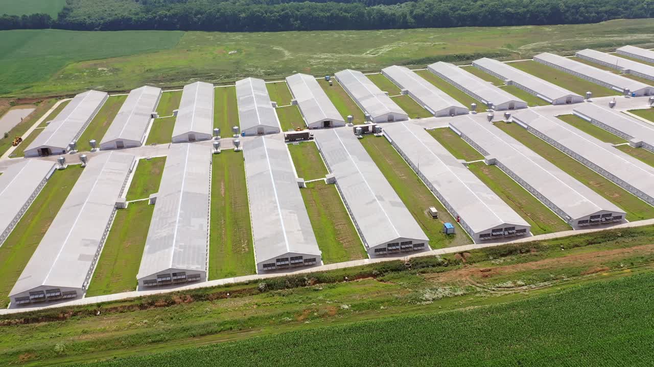 Aerial view over big agricultural farm. Complex of white buildings poultry farm from above