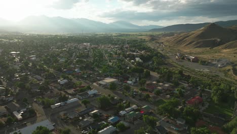 Aerial-cinematic-drone-sunset-afternoon-summer-downtown-Salida-Lime-Mill-Colorado-near-Buena-Vista-Arkansas-River-Riverside-Park-Scout-surfing-biking-hiking-rafting-Rocky-Mountain-forward-pan-motion