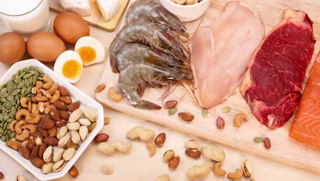 variety of meats, nuts, and eggs on display