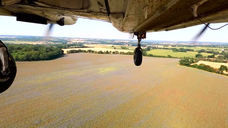 Aerial-view-taken-under-a-PA-34-Seneca-landing-on-the-grass-runway-at-Stapleford-Airport