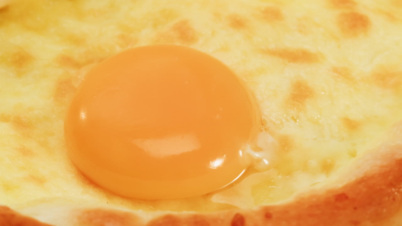 Close-up of a  cheesy pie with egg