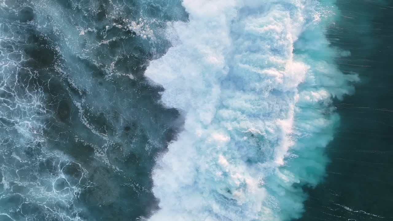 Breaking waves during sunset on a beach in Lanzarote