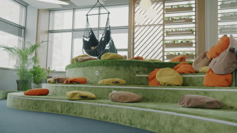 modern office lounge with comfortable seating and hammocks