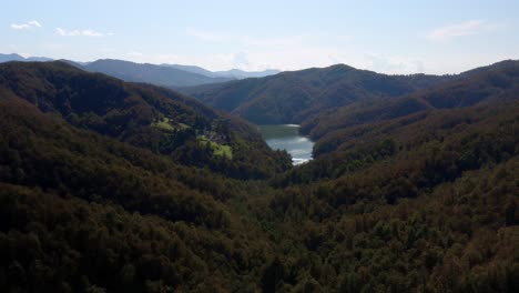 aerial view of a lake through the mountains in italy