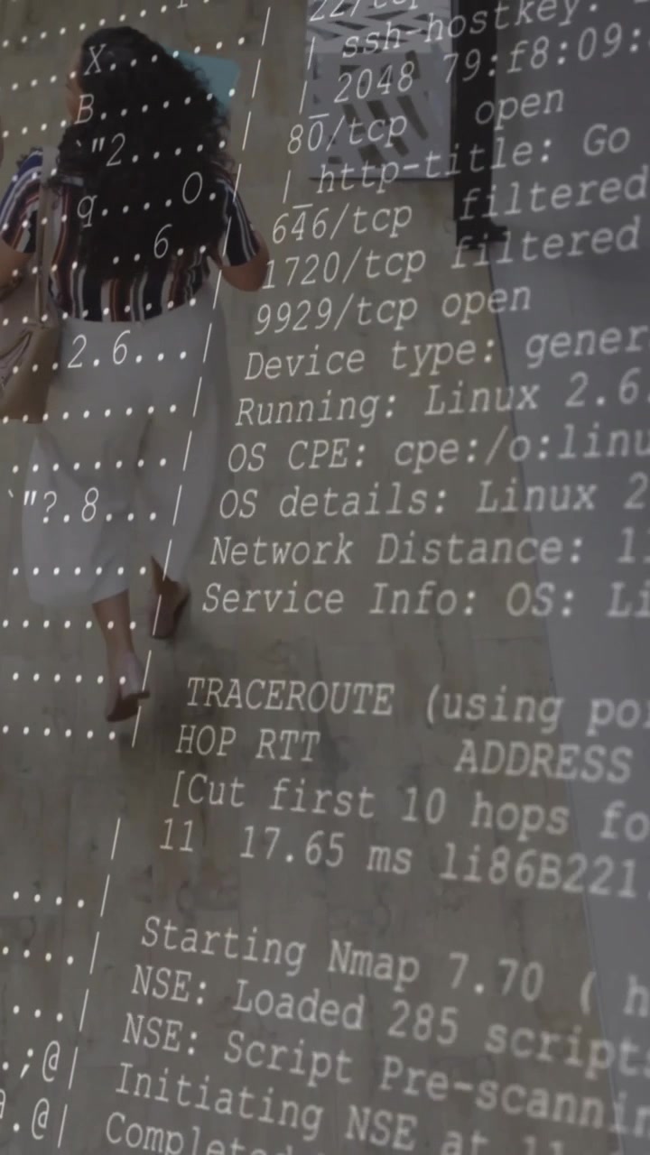 Computer code and network scanning animation over people walking in hallway