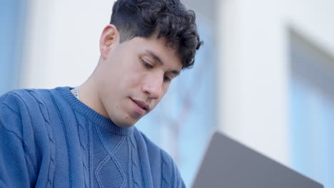 young latin man working on laptop, multiple views