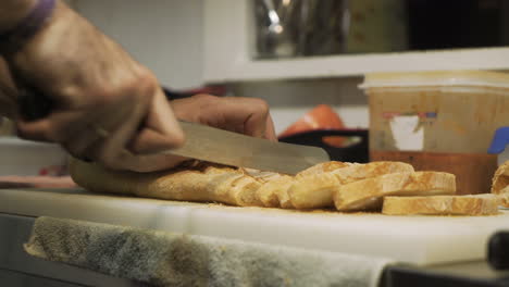 slicing bread in the kitchen