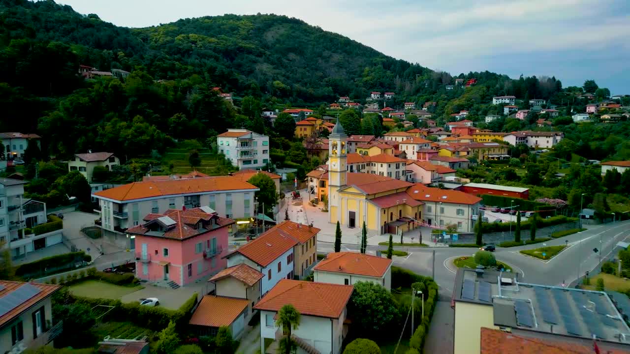4K Aerial Drone Video of Church Belltower and Roundabout in Cavallasca, Italy on a Summer Evening