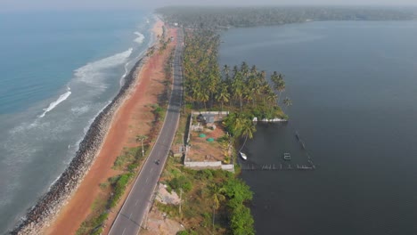 birds eye view showing a highway built between vast sea and river